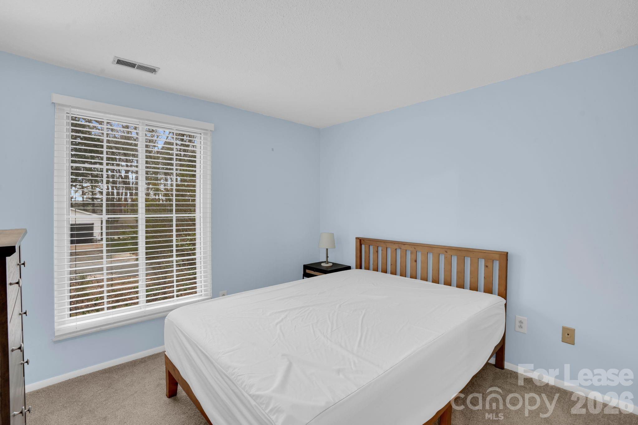 2427 Studley Road Charlotte, NC 28212 - Photo 18 of 30 a bedroom with a bed and window