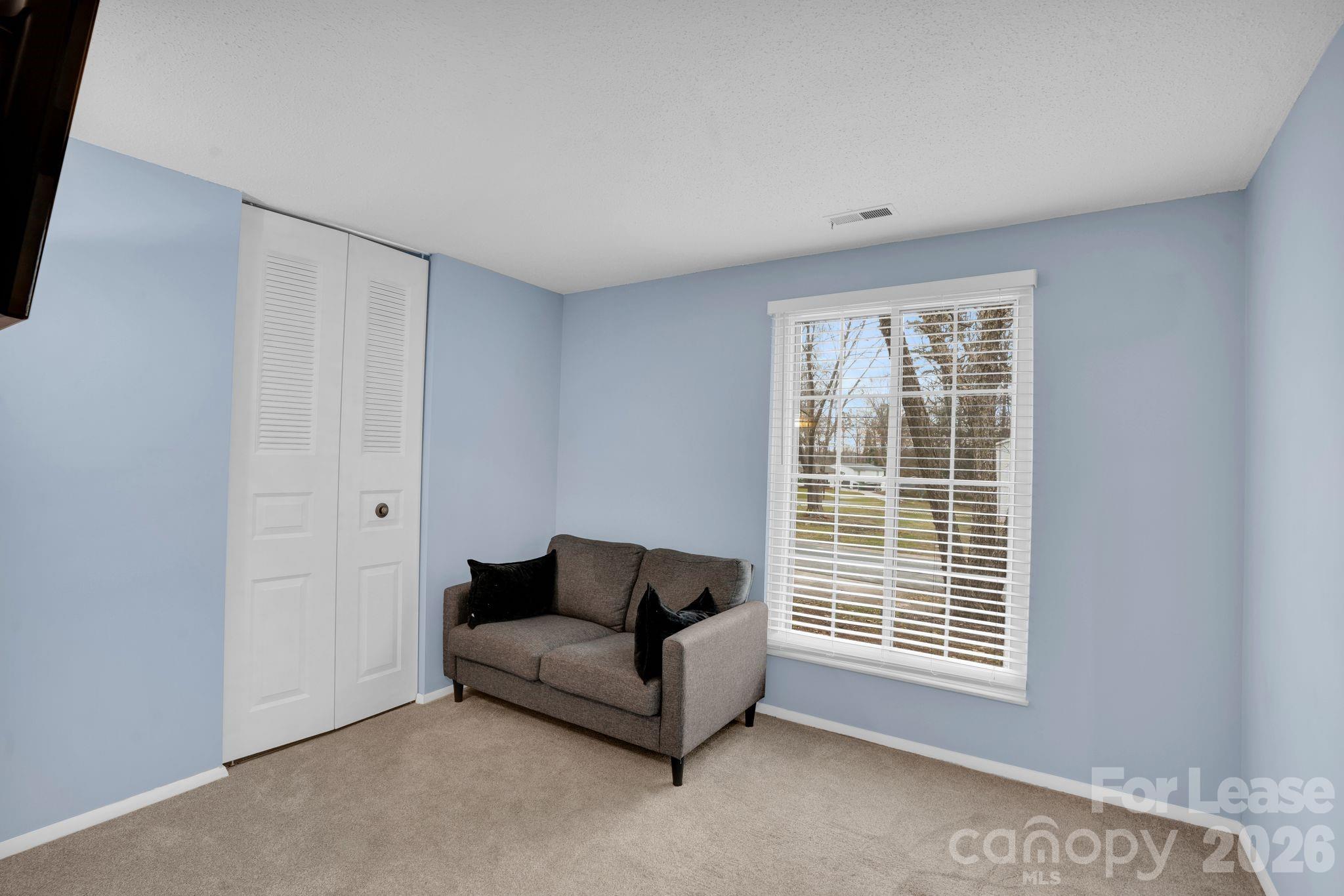 2427 Studley Road Charlotte, NC 28212 - Photo 19 of 30 a living room with furniture and a window