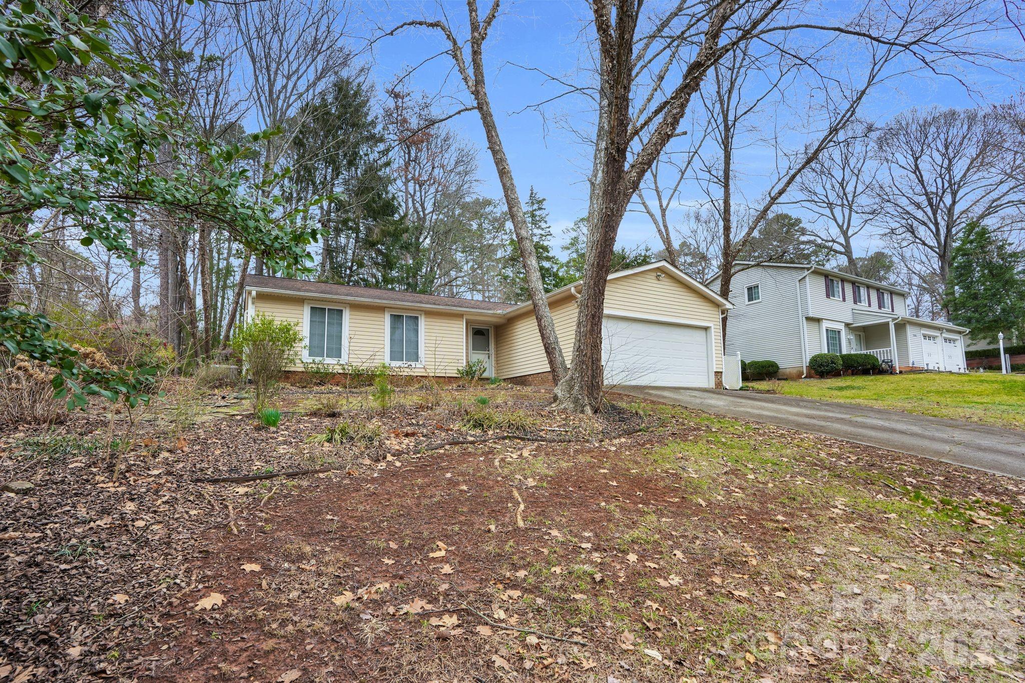 2427 Studley Road Charlotte, NC 28212 - Photo 2 of 30 a house that has a tree in front of it
