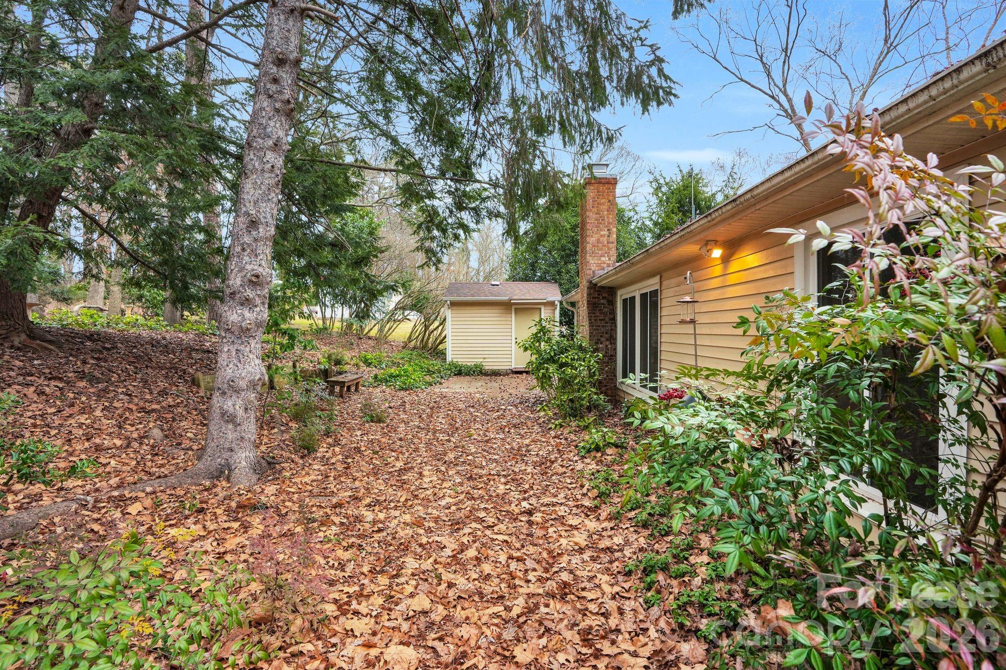 2427 Studley Road Charlotte, NC 28212 - Photo 26 of 30 a backyard of a house with lots of green space