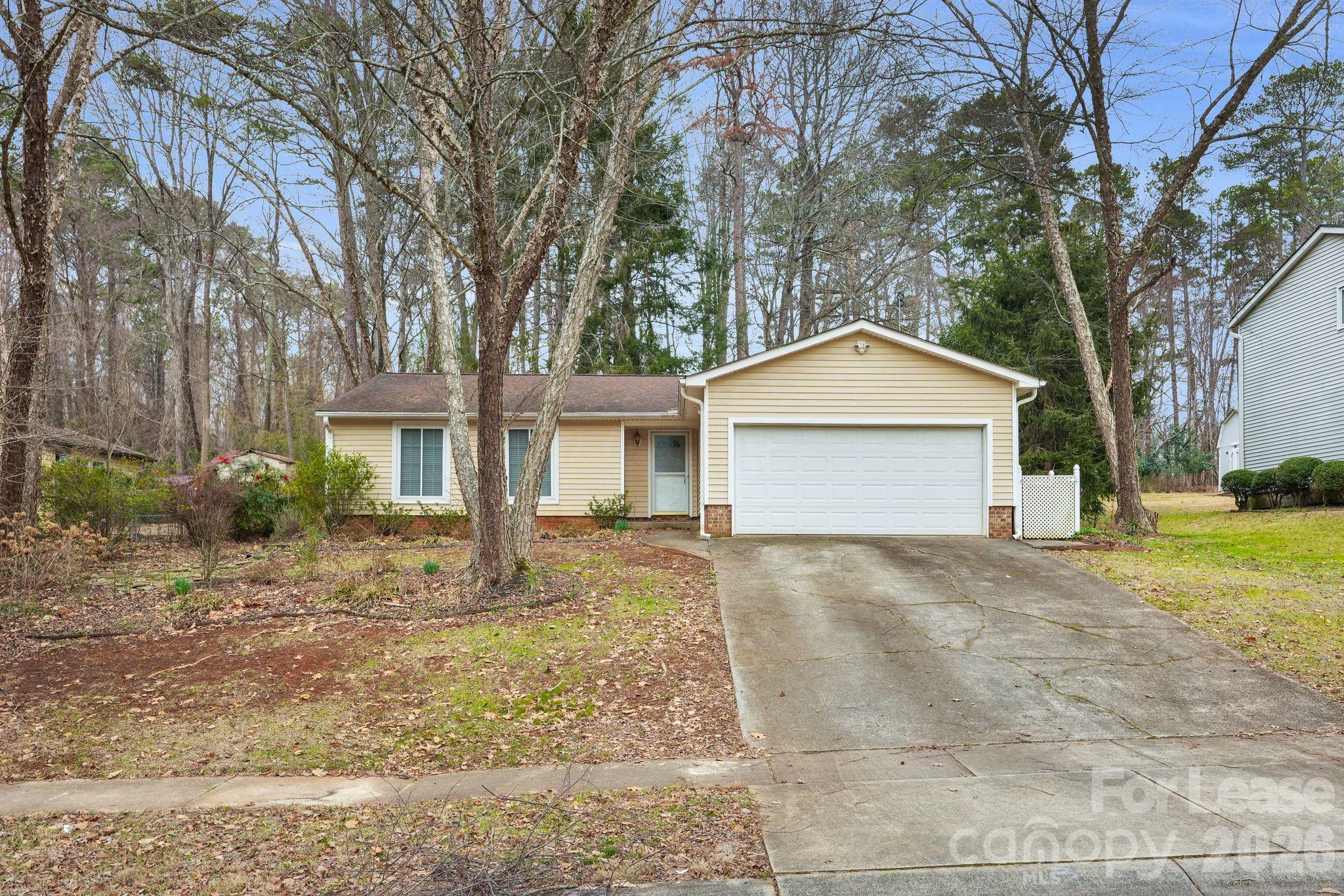 2427 Studley Road Charlotte, NC 28212 - Photo 4 of 30 a view of a house with a yard and large tree