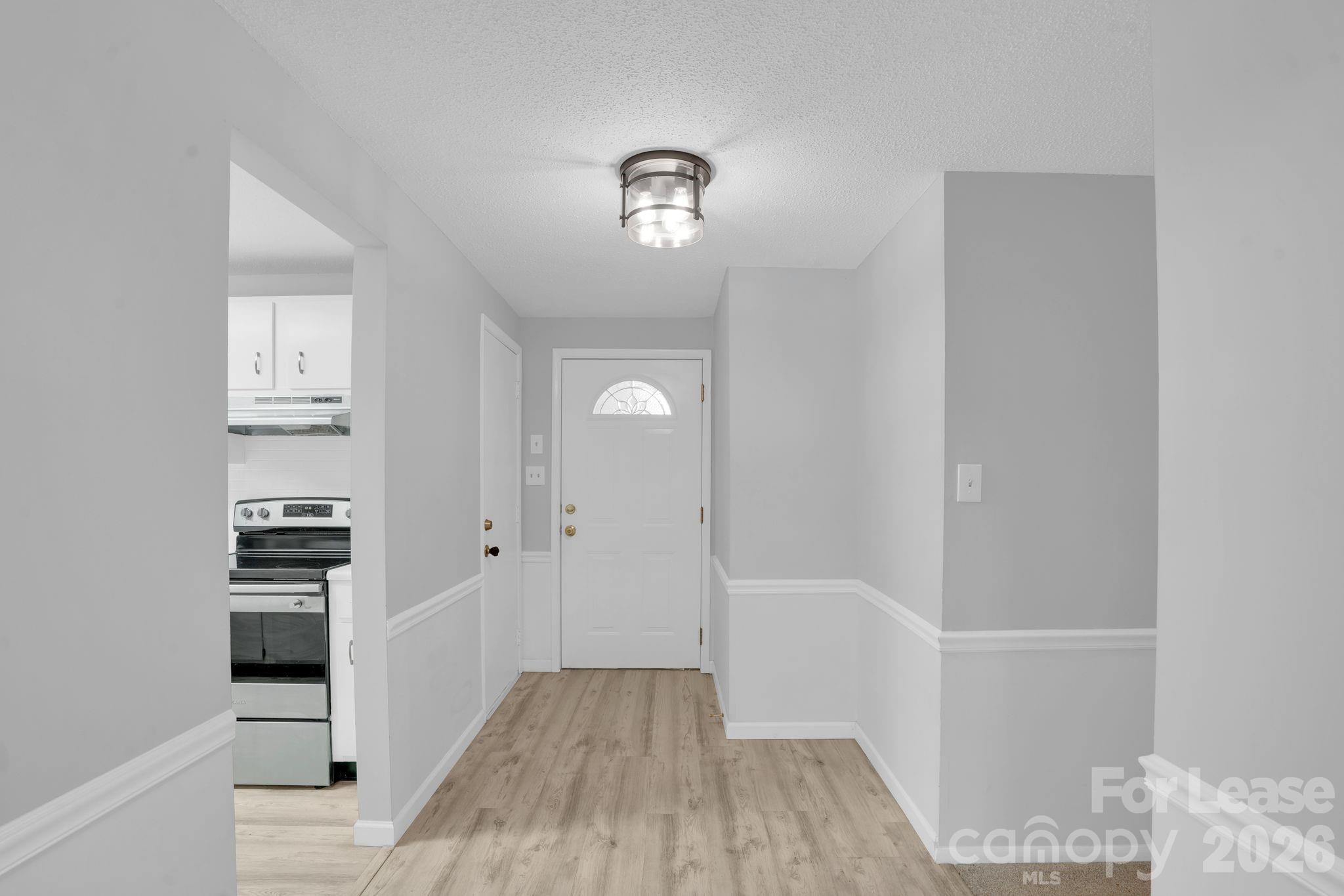 2427 Studley Road Charlotte, NC 28212 - Photo 6 of 30 wooden floor in an empty room with a window