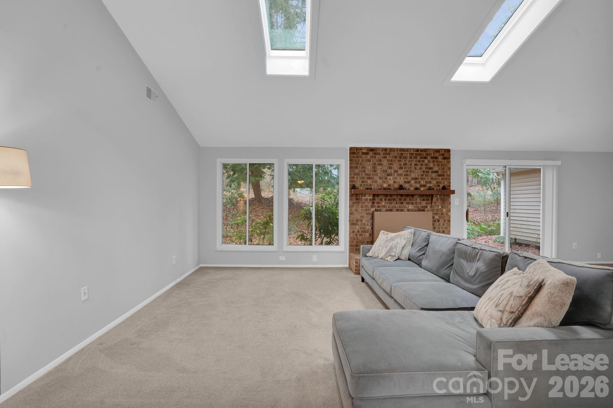 2427 Studley Road Charlotte, NC 28212 - Photo 7 of 30 a living room with furniture and a large window