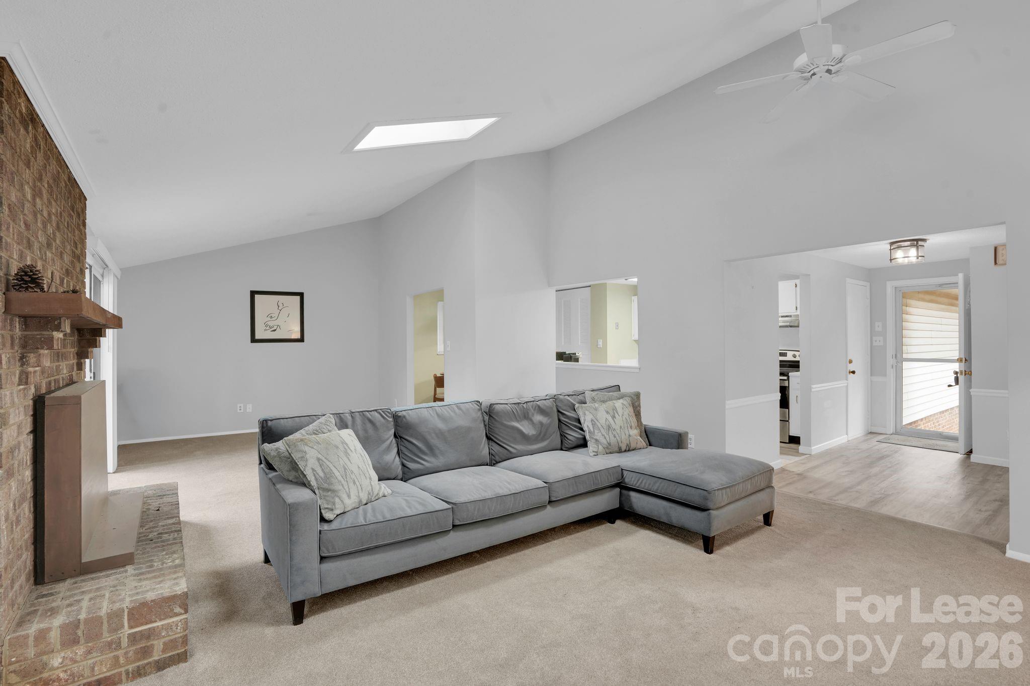 2427 Studley Road Charlotte, NC 28212 - Photo 9 of 30 a living room with furniture and a couch