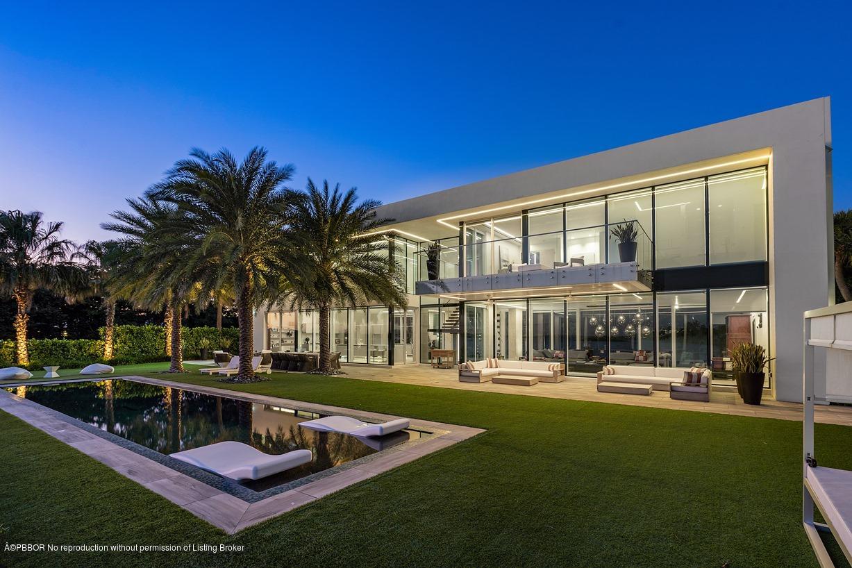 2299 Ibis Isle Road East Palm Beach, FL 33480 - Photo 1 of 37 a view of a house with swimming pool and sitting area