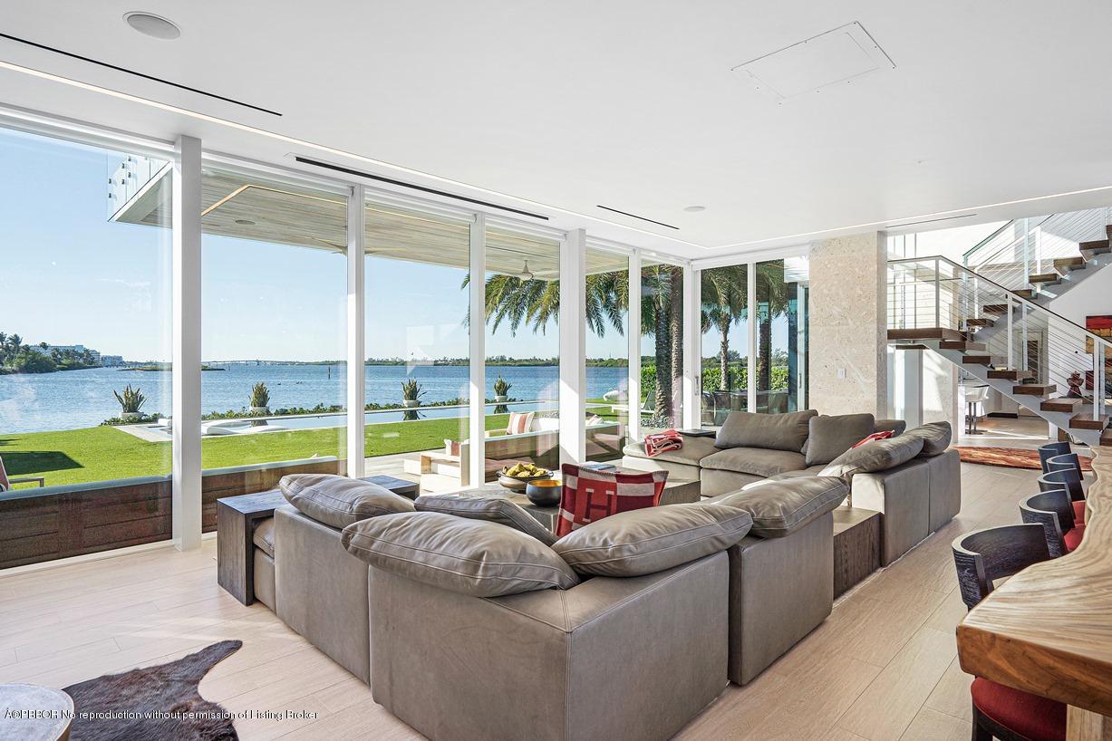 2299 Ibis Isle Road East Palm Beach, FL 33480 - Photo 15 of 37 a living room with furniture and a large window