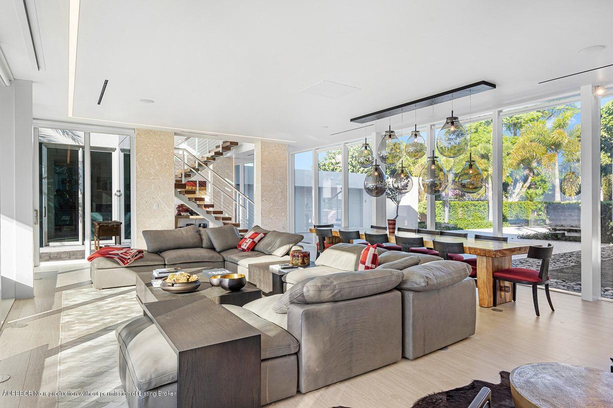 2299 Ibis Isle Road East Palm Beach, FL 33480 - Photo 16 of 37 a living room with furniture and a large window