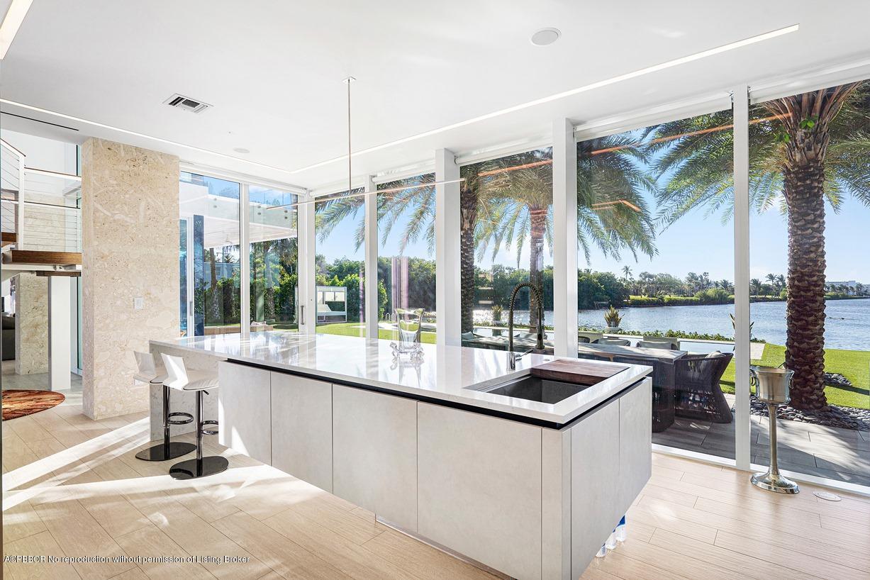 2299 Ibis Isle Road East Palm Beach, FL 33480 - Photo 18 of 37 a very nice looking living room with a large window and kitchen