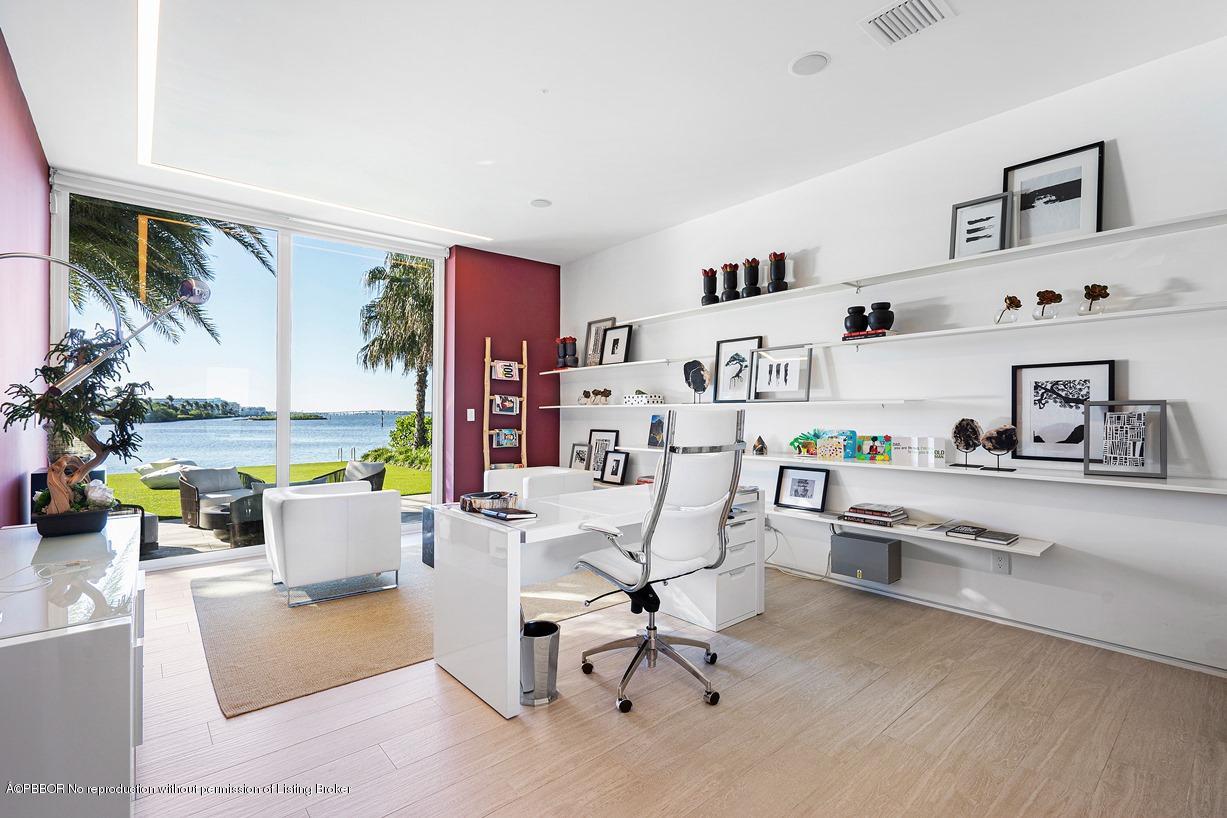 2299 Ibis Isle Road East Palm Beach, FL 33480 - Photo 19 of 37 a work room with furniture and wooden floor