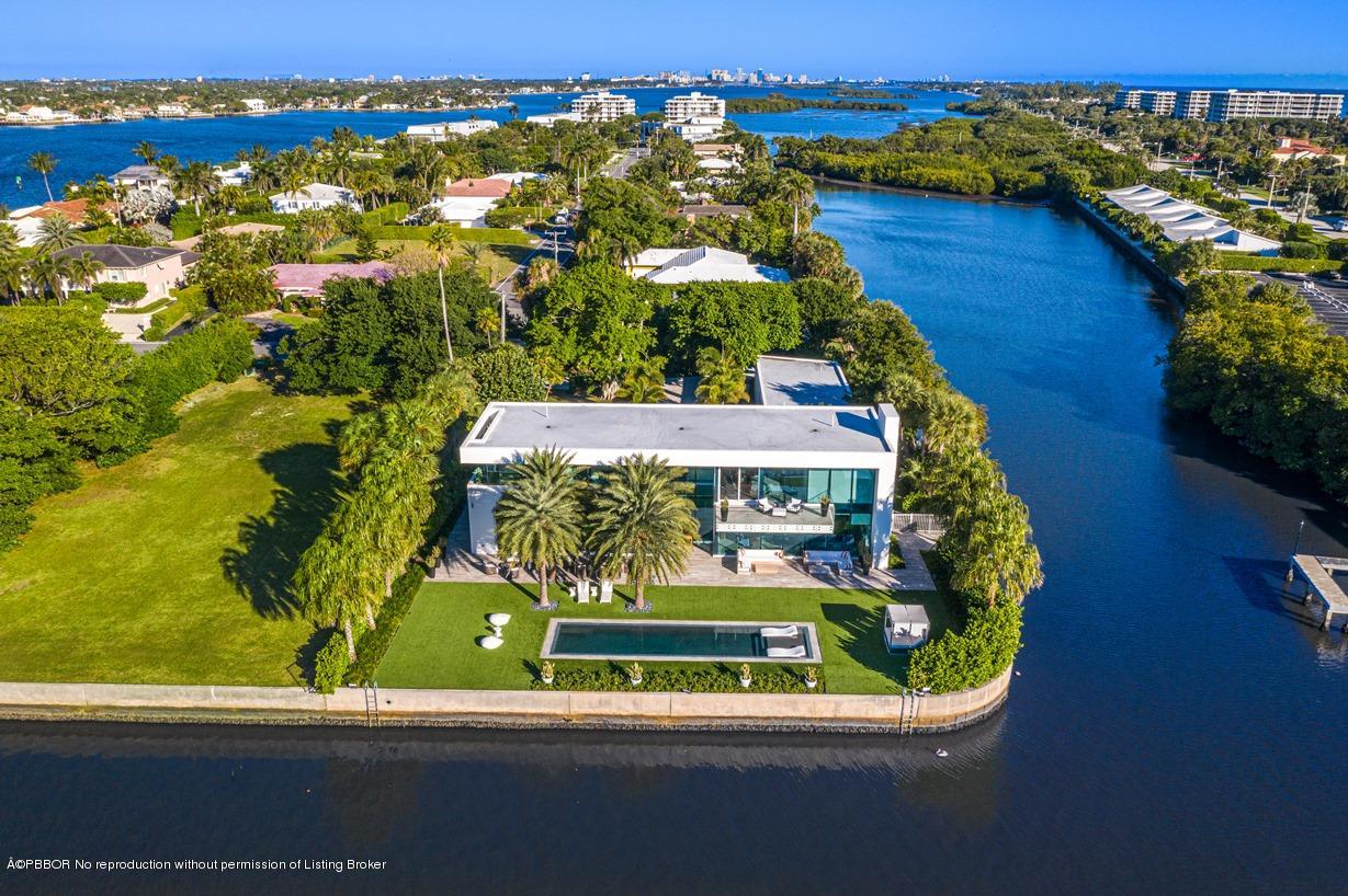 2299 Ibis Isle Road East Palm Beach, FL 33480 - Photo 29 of 37 an aerial view of a house with a yard and lake view
