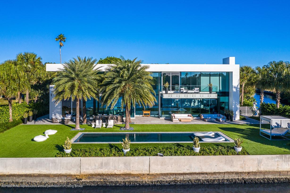 2299 Ibis Isle Road East Palm Beach, FL 33480 - Photo 30 of 37 a view of swimming pool with outdoor seating and yard
