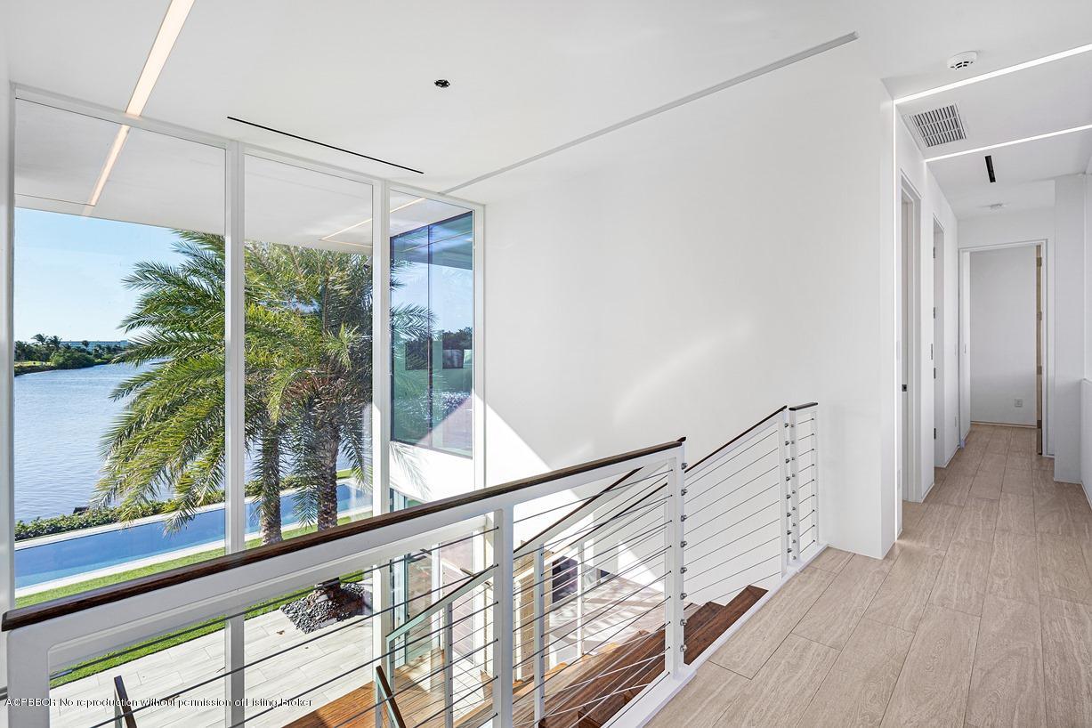 2299 Ibis Isle Road East Palm Beach, FL 33480 - Photo 31 of 37 a view of hallway with wooden floor and windows