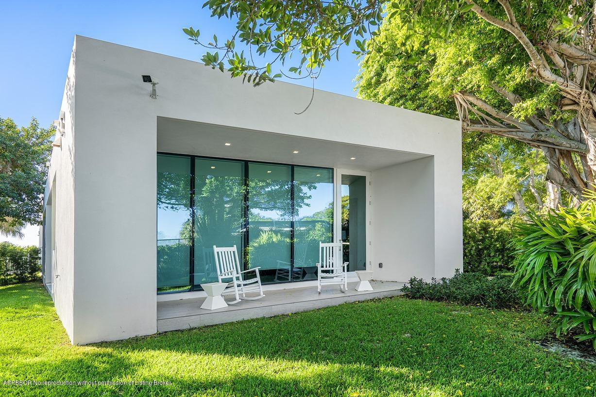 2299 Ibis Isle Road East Palm Beach, FL 33480 - Photo 35 of 37 a view of a house with backyard and sitting area