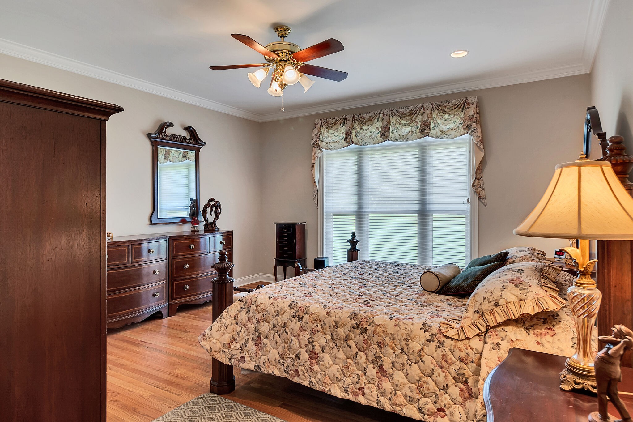 3555 Coble Road Lewisburg, TN 37091 - Photo 16 of 45 a bedroom with a bed and a chandelier