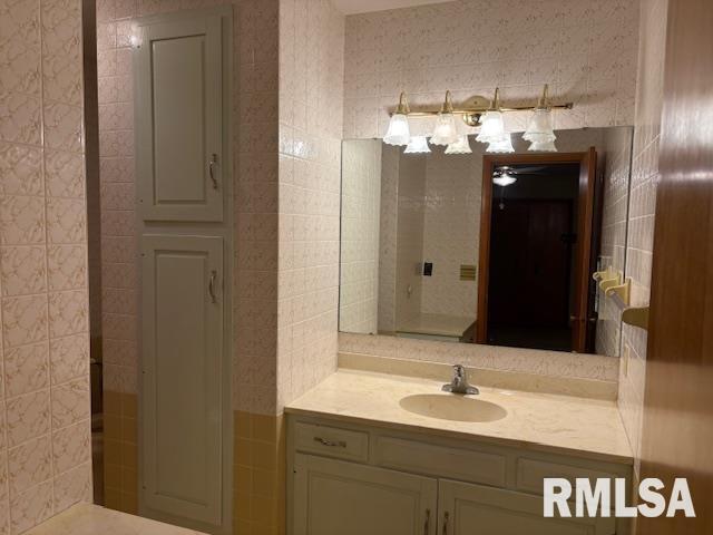 15614 63rd Street Milan, IL 61264 - Photo 22 of 25 a bathroom with a sink and a mirror