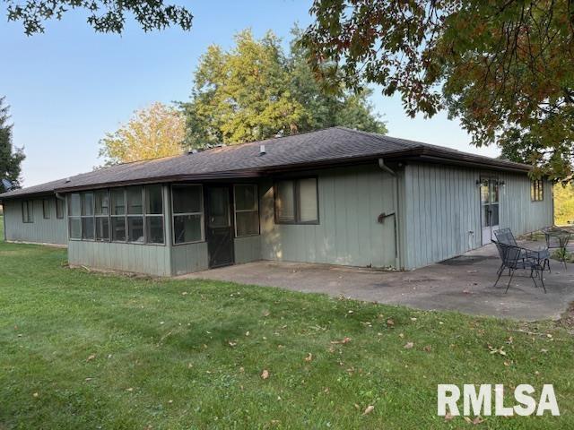 15614 63rd Street Milan, IL 61264 - Photo 4 of 25 a backyard of a house with table and chairs