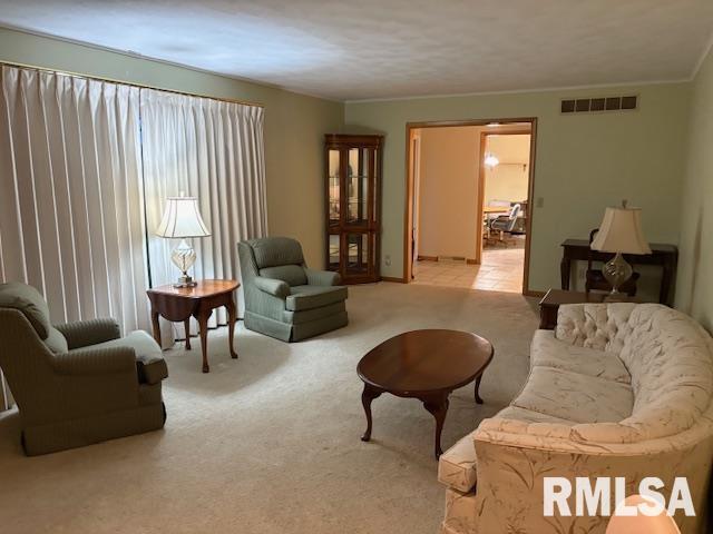 15614 63rd Street Milan, IL 61264 - Photo 8 of 25 a living room with furniture and a large window