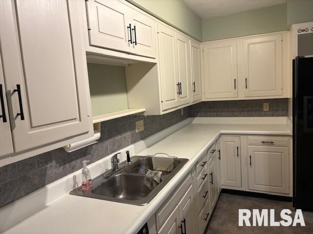 15614 63rd Street Milan, IL 61264 - Photo 9 of 25 a kitchen with granite countertop white cabinets and sink
