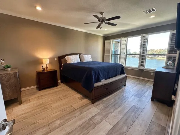 a bedroom with furniture and a window