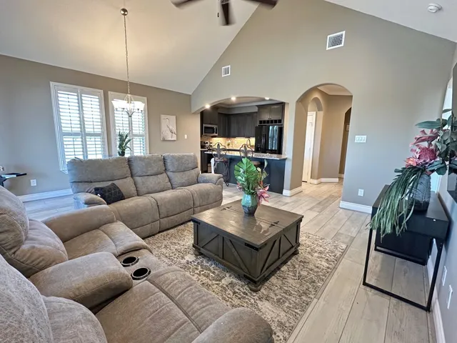 an aerial view of a house with a lake view