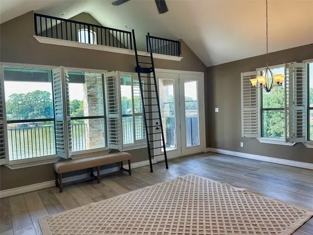 a bedroom with furniture and a window