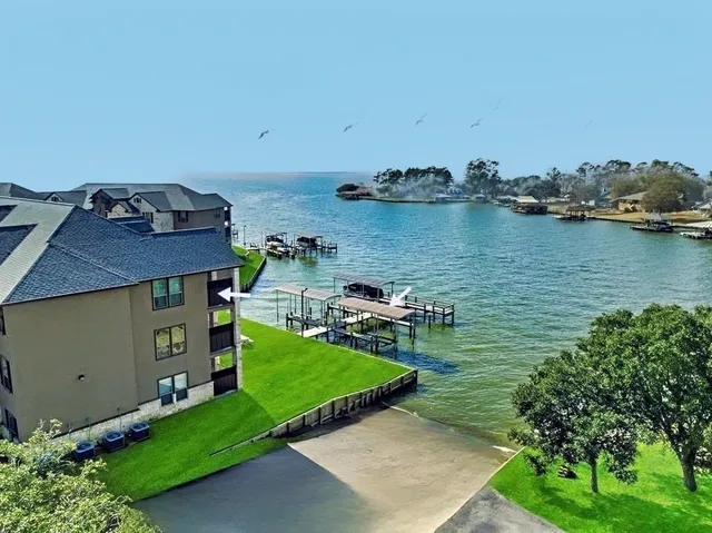 a view of a house with swimming pool and yard