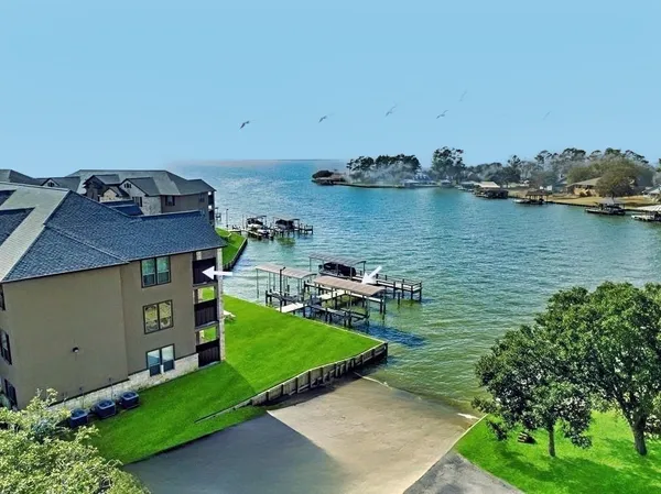 a view of a house and a backyard