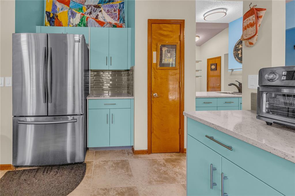 1035 Sirus Trail Sarasota, FL 34232 - Photo 13 of 48 a kitchen with stainless steel appliances granite countertop a refrigerator and a sink