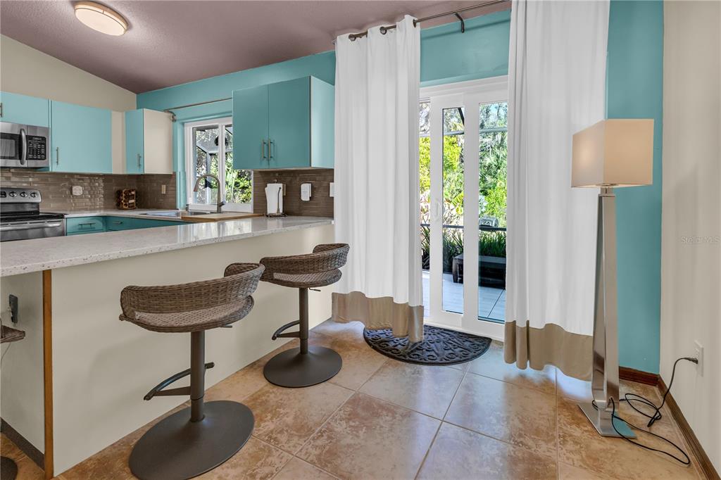 1035 Sirus Trail Sarasota, FL 34232 - Photo 14 of 48 a kitchen with a table and chairs