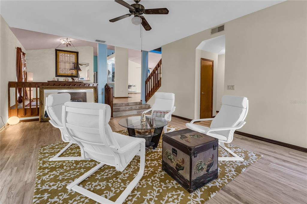 1035 Sirus Trail Sarasota, FL 34232 - Photo 20 of 48 a living room with a couch and a wooden floor