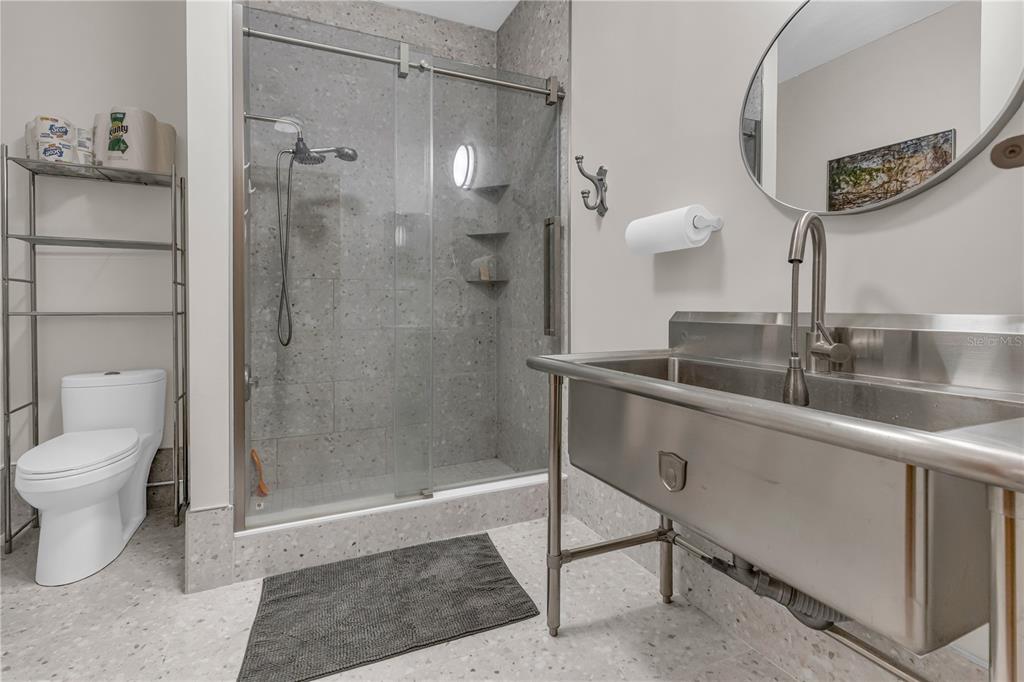 1035 Sirus Trail Sarasota, FL 34232 - Photo 21 of 48 a bathroom with a sink a toilet and shower