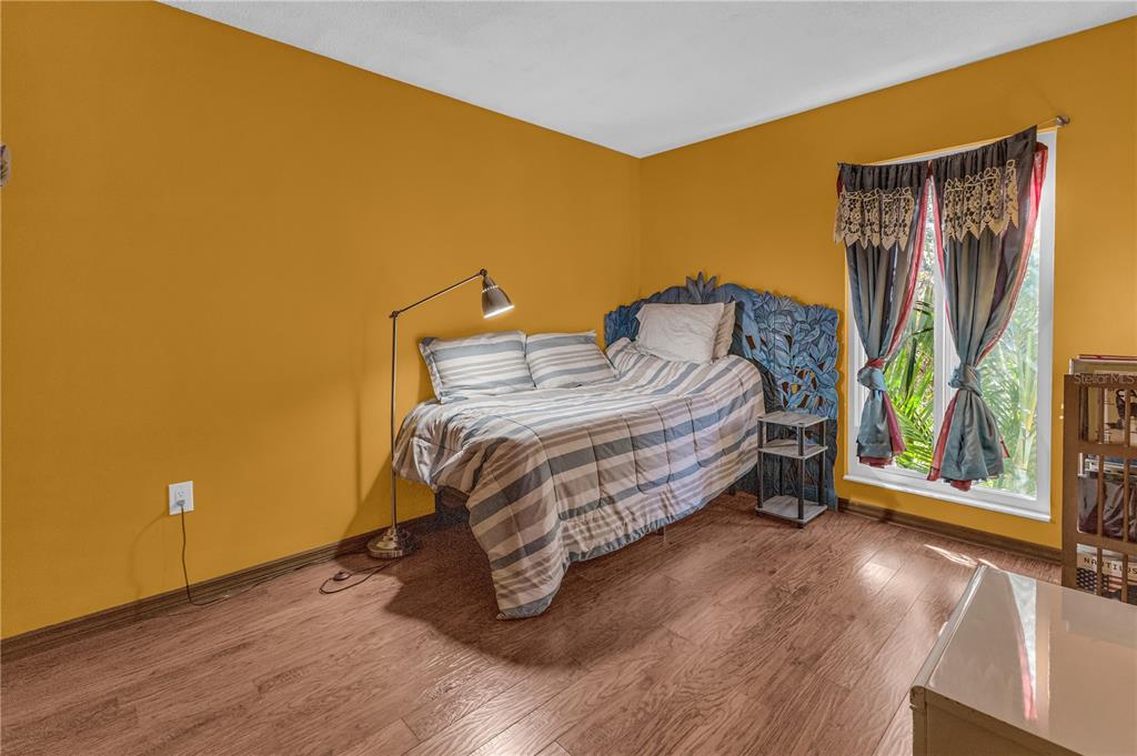 1035 Sirus Trail Sarasota, FL 34232 - Photo 25 of 48 a bedroom with a bed and a window