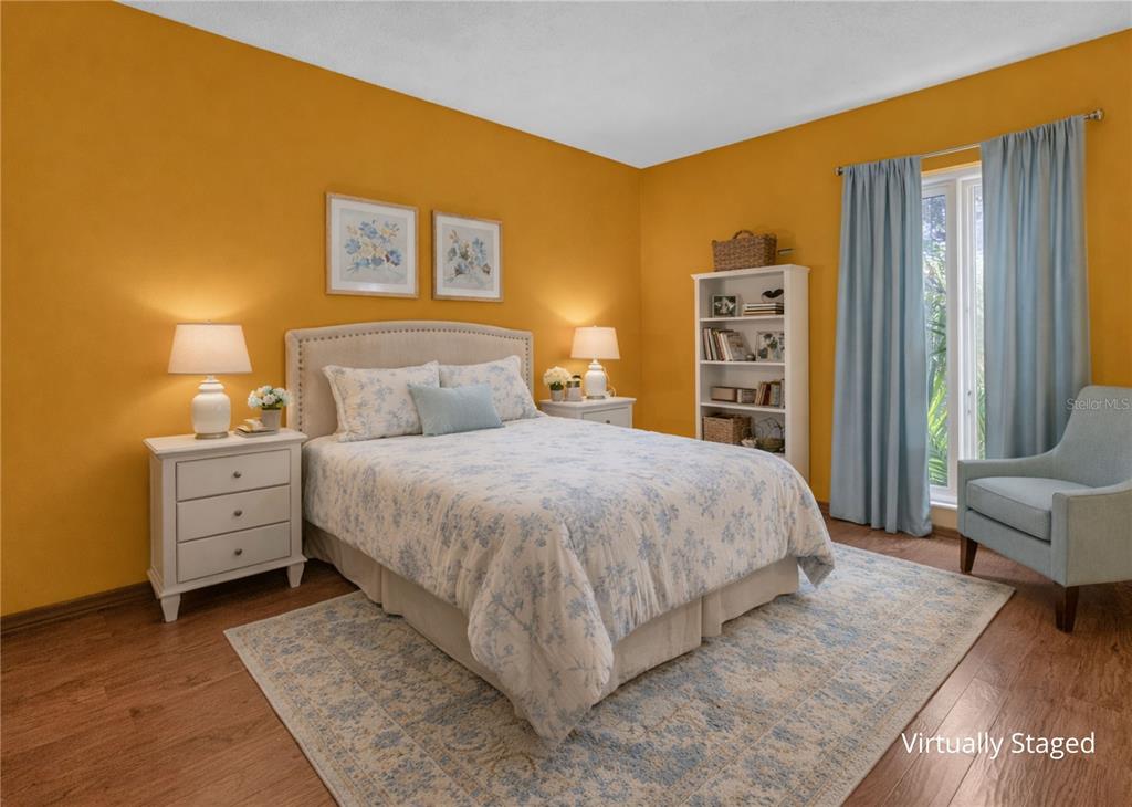 1035 Sirus Trail Sarasota, FL 34232 - Photo 27 of 48 a bed room with a bed and a chair