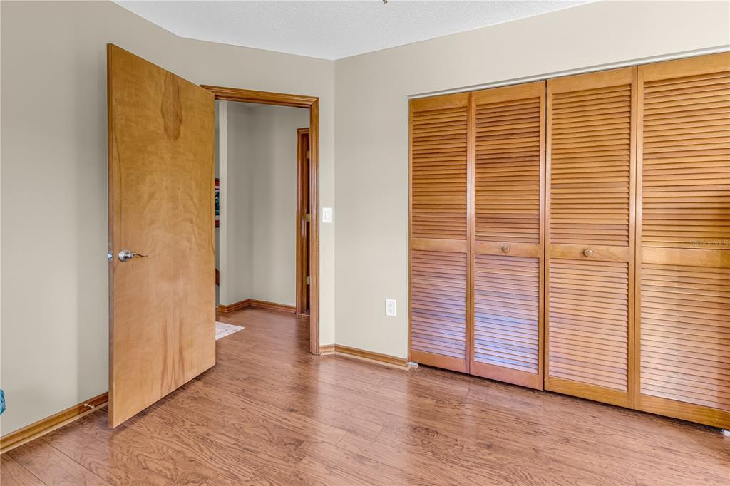 1035 Sirus Trail Sarasota, FL 34232 - Photo 30 of 48 a view of a livingroom with wooden floor and closet