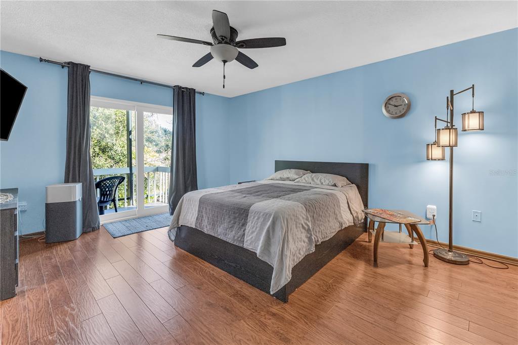 1035 Sirus Trail Sarasota, FL 34232 - Photo 31 of 48 a spacious bedroom with a bed and a large window