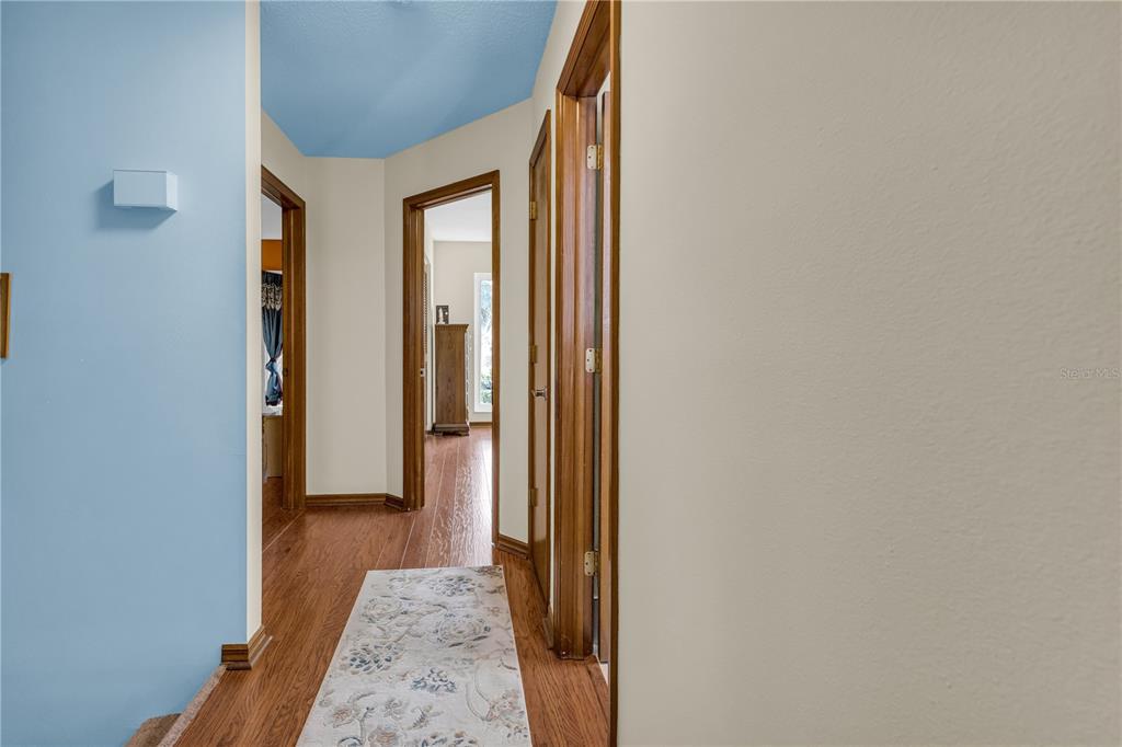 1035 Sirus Trail Sarasota, FL 34232 - Photo 37 of 48 a view of hallway with wooden floor