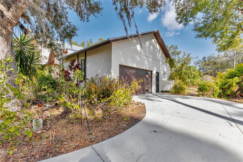 1035 Sirus Trail Sarasota, FL 34232 - Photo 40 of 48 a view of a house with a yard