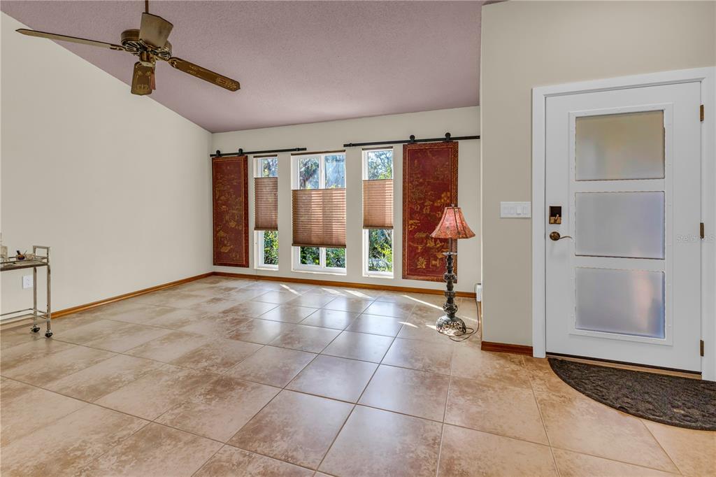 1035 Sirus Trail Sarasota, FL 34232 - Photo 4 of 48 a view of an entryway with wooden floor