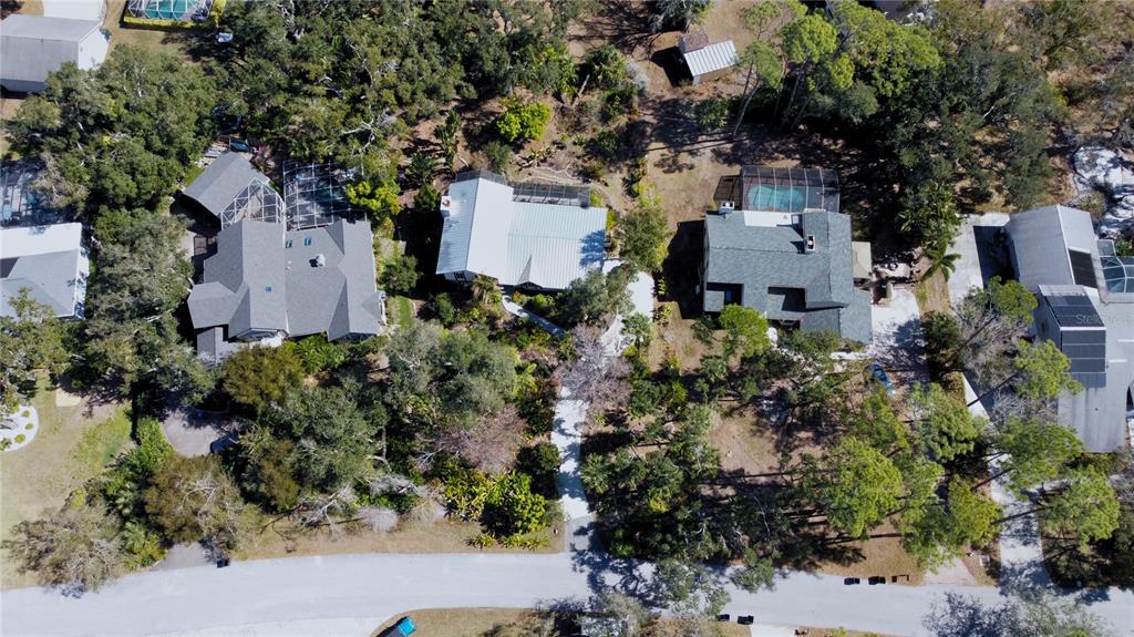 1035 Sirus Trail Sarasota, FL 34232 - Photo 46 of 48 an aerial view of a house with a yard and garden