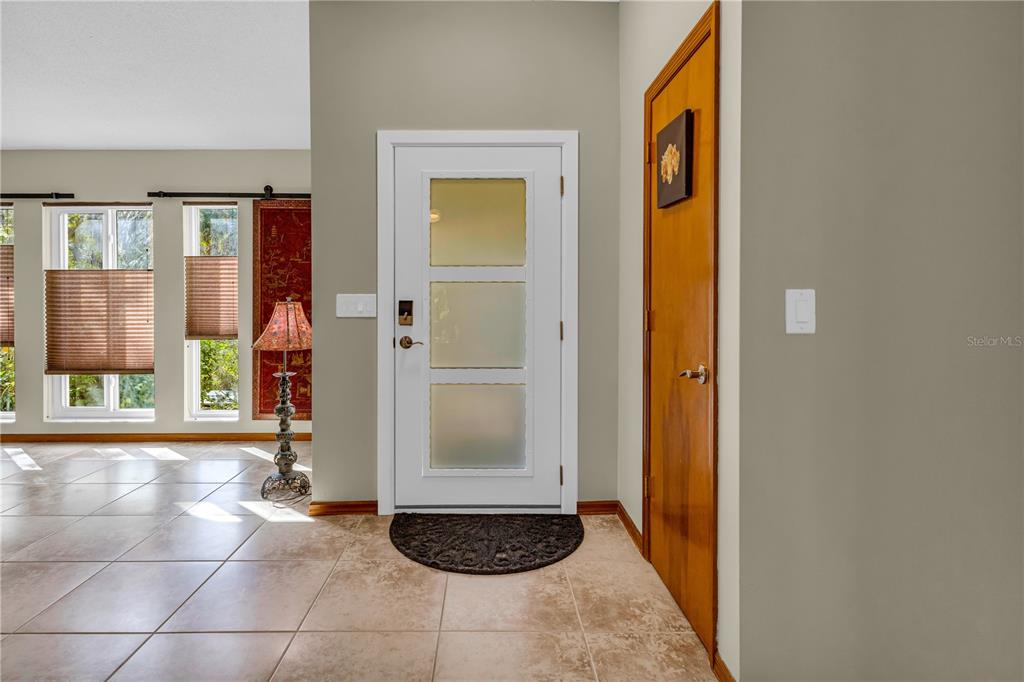1035 Sirus Trail Sarasota, FL 34232 - Photo 5 of 48 a view of a entryway door of the house