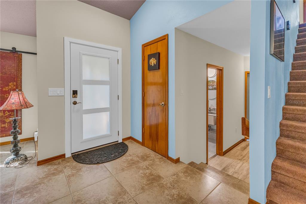 1035 Sirus Trail Sarasota, FL 34232 - Photo 6 of 48 a view of a livingroom with wooden floor and cabinet