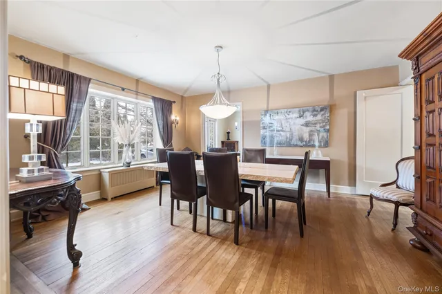 a dining room with furniture window wooden floor