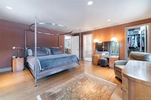 a bedroom with a bed window and couch