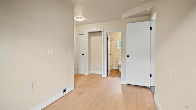 a view of a bathroom with a shower and a sink