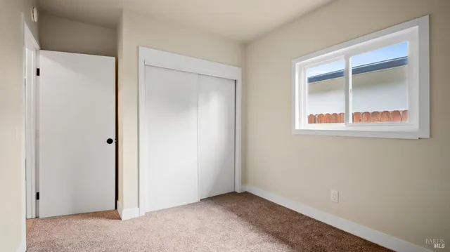 an empty room that has a window