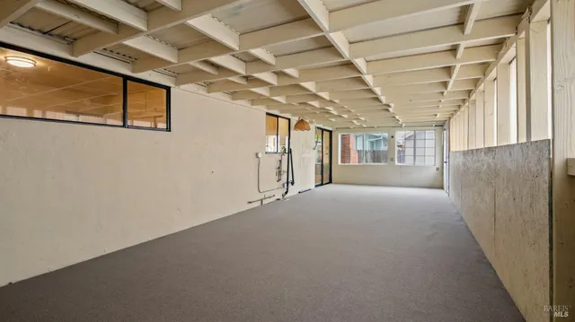 a view of a room with wooden walls