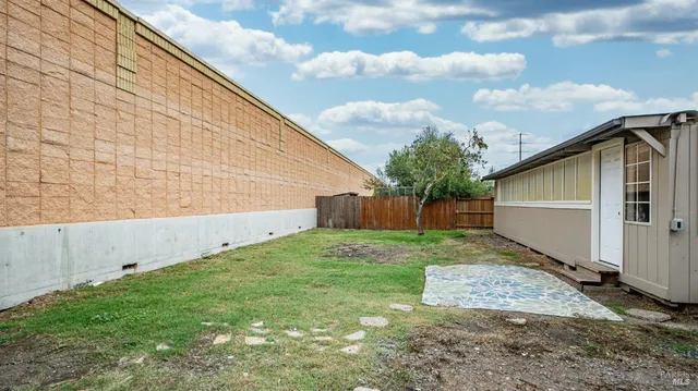 a backyard of a house with lots of green space