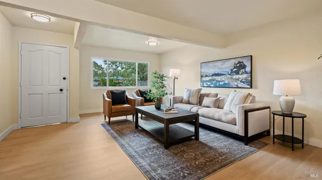 a living room with furniture and a window