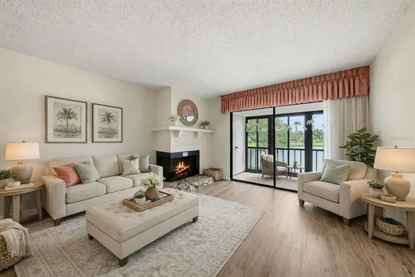 a living room with furniture and a fireplace