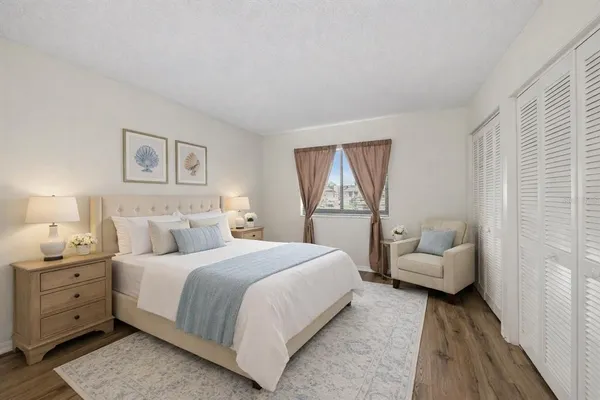 a bedroom with a bed and a couch